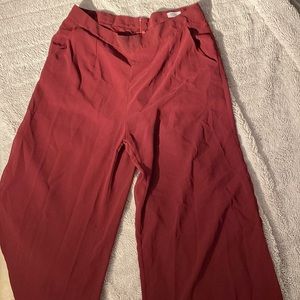Wide leg burgundy pants. Shorts underneath. Pant leg semi-see through